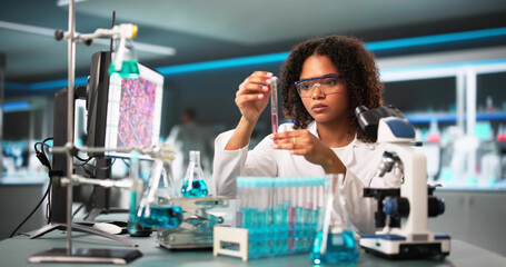 Poster - Scientist Looking At Test Tube