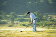 © freebird7977 - Golfer sport course golf ball fairway.  People lifestyle man approach playing game golf tee off on the green grass.  Asian man player game shot in summer.  Healthy and Sport