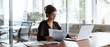 © Stock 4 You - Businesswoman holding document working at laptop pc computer doing online tax invoice, financial report. Focused Hispanic business woman manager specialist with paperwork in office. Banner, copy space