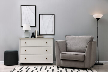 Poster - dresser and other furniture near light grey wall in room. interior design