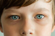 © irena_geo - Child’s eyes look at the camera. Close -up portrait. The concept of diseases of children's eyes. Visual violation. Astigmatism, farsightedness, myopia, strabismus.