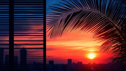 Wall Mural - a cityscape with a palm tree in the foreground and a beautiful sunset viewed through a window