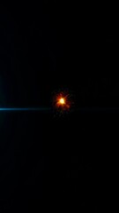 Wall Mural - Dynamic explosion of fiery starburst with radiating energy sparks in dark space