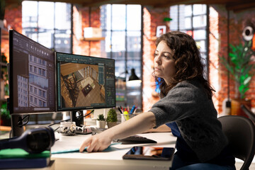 Worker in a creative office uses CAD software to design a house interior, provides a user interface for virtual home planning. Woman developer creating a precise architectural layout and adjustments.