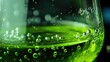 © MP_Artworks - Close-up of a vivid green chemical reaction in a beaker. Fizzing bubbles pop in slow motion, showing dynamic lab activity—ideal for science visuals, chemistry demos, or educational content.