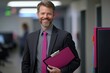 © Attasit - A Happy Business Professional Holding A Clipboard, Smiling While Walking Through A Corporate Office