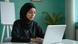 © Vadym - Muslim businesswoman in hijab works at laptop. Islamic Arabian student e-learning, typing online, web browsing. Confident ethnic freelancer studies on computer in network, chats online, e-commerce