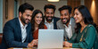 © redtiger9 - Indian Professionals Collaborating in Front of Laptop in a Modern Office for Teamwork and Productivity