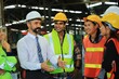 © Mallika - Group of workers in warehouse
