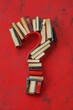 © Alla - A creative representation of a question mark using books, perfect for concepts related to knowledge, learning, and curiosity