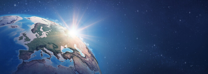Wall Mural - sunrise on detailed satellite cartography of earth globe, western europe, deep space banner - elemen
