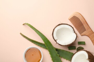 Wall Mural - hair treatment. fresh coconut, honey, comb and aloe leaves on beige background, flat lay. space for 