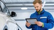 © GoodandEvil - Mechanic Analyzing Data On Tablet Near Car Interior