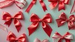 © StockKing - Elegant arrangement of shiny red satin bows on soft pastel green and pink backgrounds showcasing a variety of sizes and styles for festive decor.