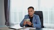 © pixs4u - Happily Businessman in suit Counting Money on desk in Office