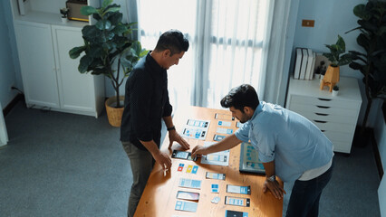 Wall Mural - top view of front-end developer design ux ui design for mobile phone interface with multicultural te