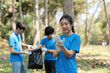 © Natee Meepian - Teamwork and Environmental Stewardship. A volunteer prepares to assist in the clean-up, showing dedication to sustainability in nature.