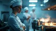 © vasyan_23 - Female chef in professional kitchen overseeing culinary preparations and cooking