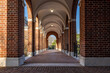 © Thomas - Old arched brick walkway with brick pillars