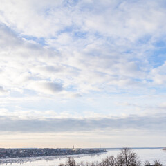 Wall Mural - evening sky over river in kostroma city in winter