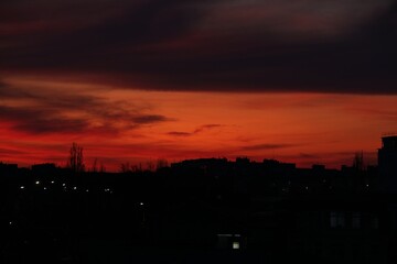 Wall Mural - view of beautiful sky over city at sunset