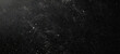 © vejaa - Dark grunge paper texture with distressed, scratched surface and white dust particles. Retro vintage style black background with subtle imperfections
