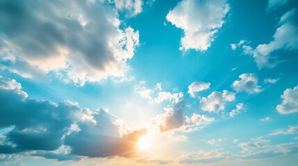 Wall Mural - Sunset with dramatic clouds and sun rays in a vibrant blue sky, nature scenery
