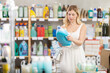 © JackF - Woman consumer with household chemical products for washing indoors
