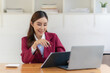 © MrAshi - Beautiful business Asian woman with suit working at office table using laptop computer with copy space. Businessman, freelance employee, online marketing