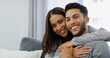 © peopleimages.com - Smile, love and portrait of couple on sofa of home for bonding, support and care. Happiness, commitment and trust with man and woman in living room of apartment peace, relax and relationship romance