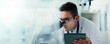 © HockleyM4/peopleimages.com - Research, tablet or man in lab with microscope, vaccine test or medical experiment for cancer treatment. Biotech, space or scientist with science results, study or sample with cure, banner or mockup