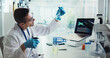 © peopleimages.com - Scientist, man and beaker for DNA in lab, test and medical research with analysis for gene editing. Person, process and glass container for chemical, laptop and charts with liquid sample for results