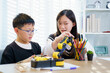 © DG PhotoStock - Asian boy and girl are learning with STEM toys, STEM is Sciences, Technology, Engineering, and Mathematics.