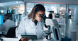 © peopleimages.com - Science, tablet and microscope with woman in laboratory for DNA discovery, healthcare or research. Gene study, medical and clinical trial with scientist in clinic for forensics, results and biotech