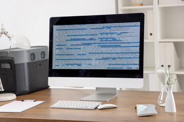 Computer monitor with code in programmer's office