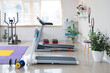 © Pixel-Shot - Interior of modern gym with sports equipment
