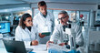 © peopleimages.com - Collaboration, medical and science with people in laboratory together for breakthrough or development. Laptop, microscope or tablet and DNA research team in clinical trial for learning with mentor