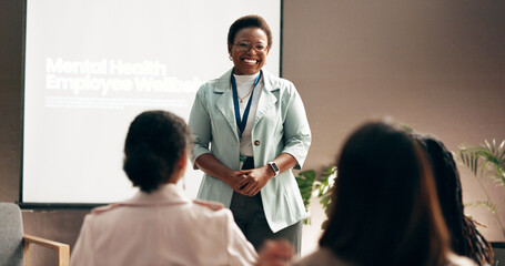 happy woman, presentation and meeting with group for mental health program or employee wellbeing at 