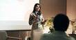 © peopleimages.com - Business woman, seminar and presentation for speaker in conference room for wellness training. Education, forum speech and microphone with corporate coach on stage for public relations or development