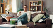 © WestLey/peopleimages.com - Man, watching tv and happy on sofa, remote or choice for show, film or sports in living room at apartment. Person, smile and streaming subscription with movies, relax and laughing on couch in home