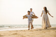 © Take Production - Asian family activity beach weekend together. Family lifestyles. Togetherness people.