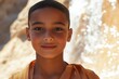 © NicotineLens  - Portrait of a Young Boy Near a Waterfall in a Desert Landscape