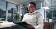 © peopleimages.com - Business, portrait or black woman with tablet in office as campaign deadline or employee. Technology, smile and African designer in creative startup as brand specialist with glasses at night in Kenya