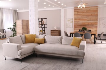 Poster - stylish living room interior with comfortable sofa and wooden table