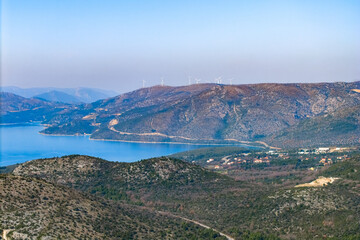 aerial panorama view of a mountain with wind farm in the distance near dubrovnik, dalmatia region, c