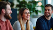 © mangolovemom - group of young professionals smiling and chatting in modern office breakout space, fostering positive and collaborative work environment