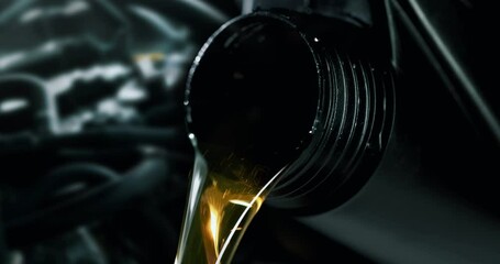 Wall Mural - change and pour new car engine oil into the motor