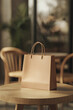 © heerim studio - Shopping bag on wooden table in cozy space