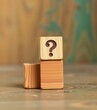 © photohappy - Four wooden cubes stacked, question mark carved on top, why, investigation