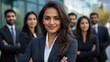 © PRASANNAPIX - indian businesswoman standing confidently with staff on background
